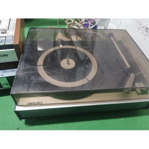 521 - A Philips three deck system including amplifier, cassette player and record deck. Complete with cabl... 