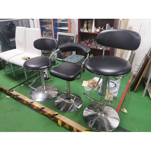524 - Three gassed bar stools with footrests, one with arm supports.
Height 111cm.