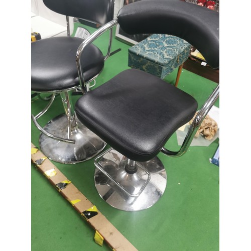 524 - Three gassed bar stools with footrests, one with arm supports.
Height 111cm.