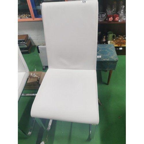 526 - A pair of white leatherette dining chairs with single chrome legs in very good clean order.
Height 1... 