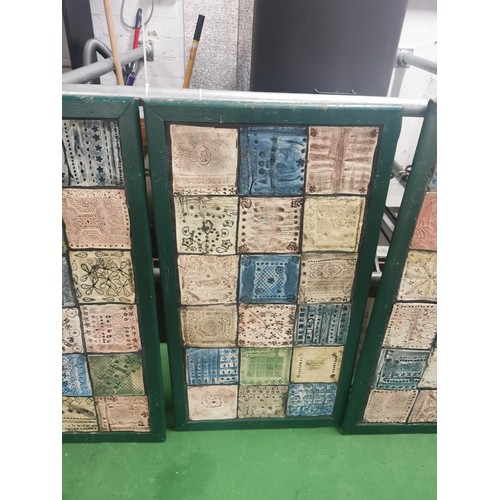 529 - Three wooden panels of naive tile art, each panel containing eighteen handmade, hand decorated tiles... 