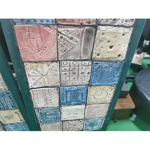 529 - Three wooden panels of naive tile art, each panel containing eighteen handmade, hand decorated tiles... 