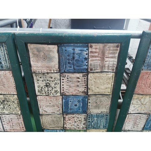 529 - Three wooden panels of naive tile art, each panel containing eighteen handmade, hand decorated tiles... 