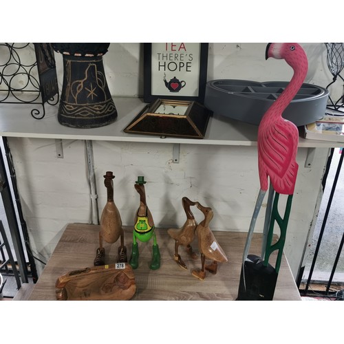 278 - A selection of fair trade items including two booted duck figures, a pair of love ducks, a tall flam... 