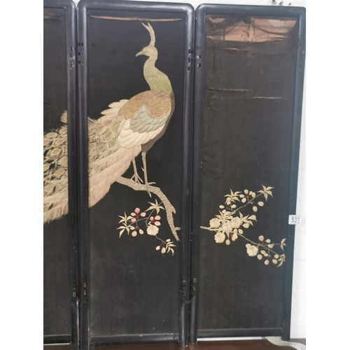 531 - An antique Asian ebonised 4 fold double sided embroidered silk screen. One side decorated with a pea... 
