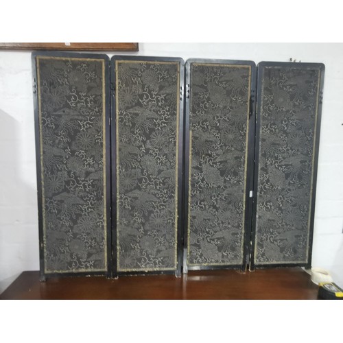 531 - An antique Asian ebonised 4 fold double sided embroidered silk screen. One side decorated with a pea... 