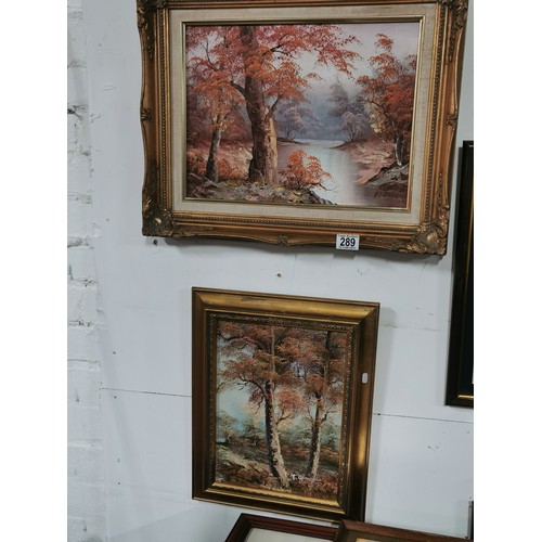 289 - A pair of framed oil paintings of woodland and river scenes. Commercial paintings. Largest measure h... 