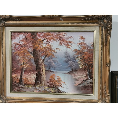 289 - A pair of framed oil paintings of woodland and river scenes. Commercial paintings. Largest measure h... 