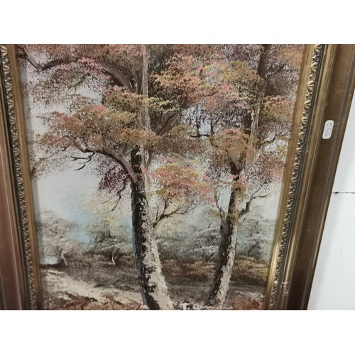 289 - A pair of framed oil paintings of woodland and river scenes. Commercial paintings. Largest measure h... 