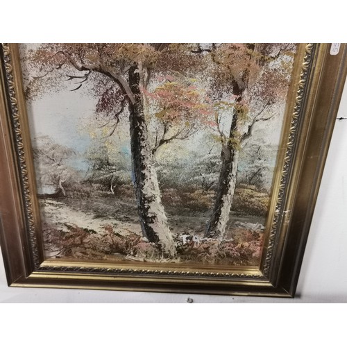 289 - A pair of framed oil paintings of woodland and river scenes. Commercial paintings. Largest measure h... 