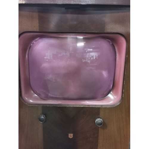 293 - An early vintage Alba television. doors at the front and speaker at the base. Comes with the rare pi... 
