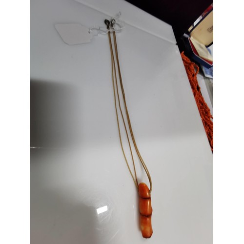 483 - 2x large African genuine coral beaded necklaces along with a rope necklace which has a large chunk o... 