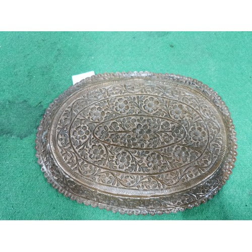 298 - An antique ornate floral design handmade copper tray.
Length 31cm Width 22cm.