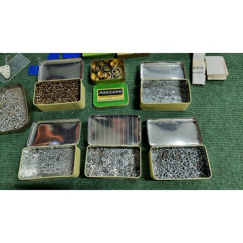 10 - Large quantity of various vintage Meccano parts and accessories most are organised into metal tinds ... 