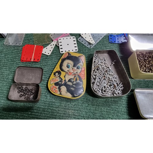 10 - Large quantity of various vintage Meccano parts and accessories most are organised into metal tinds ... 