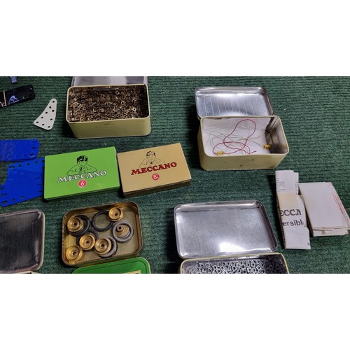 10 - Large quantity of various vintage Meccano parts and accessories most are organised into metal tinds ... 