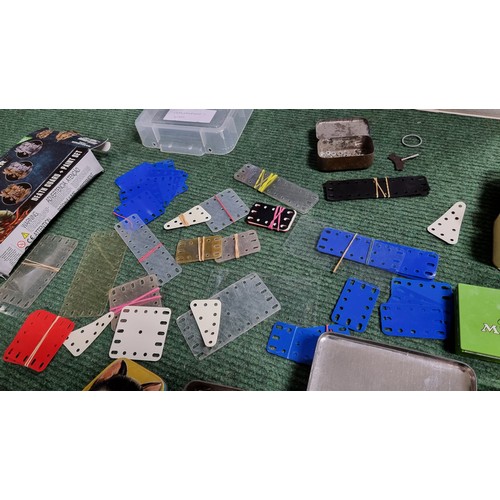 10 - Large quantity of various vintage Meccano parts and accessories most are organised into metal tinds ... 