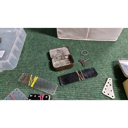 10 - Large quantity of various vintage Meccano parts and accessories most are organised into metal tinds ... 