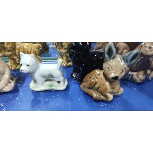 520 - A very large collection of Wade Whimsies including alligator, beavers, squirrels, giraffe, Scottie d... 