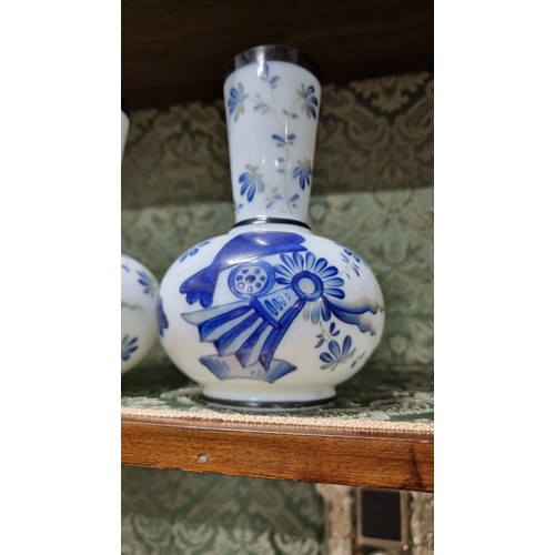 496 - A pair of milk glass hand painting vases with floral design with signature to the base in excellent ... 