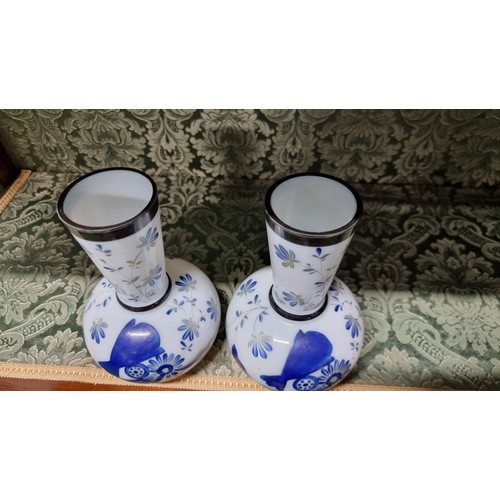 496 - A pair of milk glass hand painting vases with floral design with signature to the base in excellent ... 