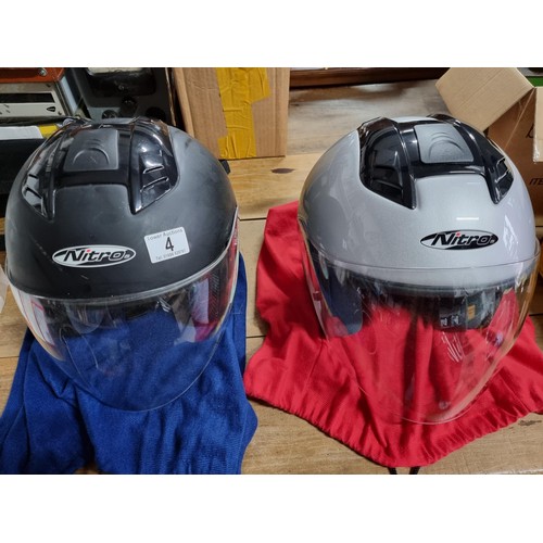 4 - 2x motorcycle helmets by Nitro Racing both appear to be unused. 1x is size medium and the other is X... 