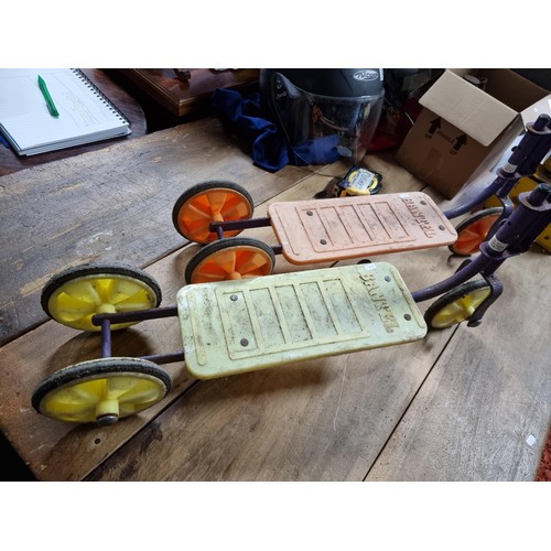 15 - Pair of vintage retro children's scooters by Bantel in a yellow and orange colour way. Both in good ... 