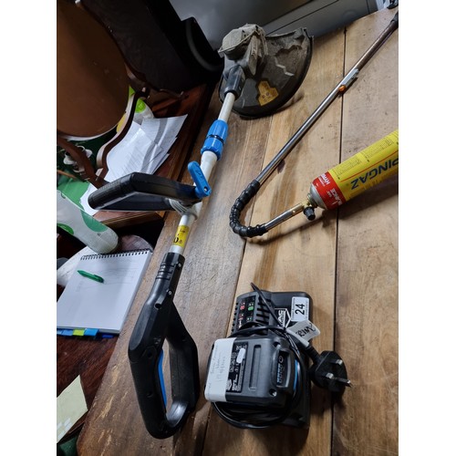 24 - Macallister cordless battery powered strimmer complete with battery and charger - working along with... 