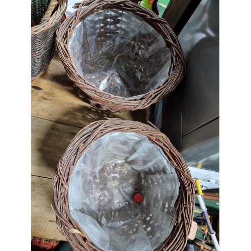 33 - 2x large wicker baskets along with 2x large wicker planters with plastic lining. Height of 35cm x di... 