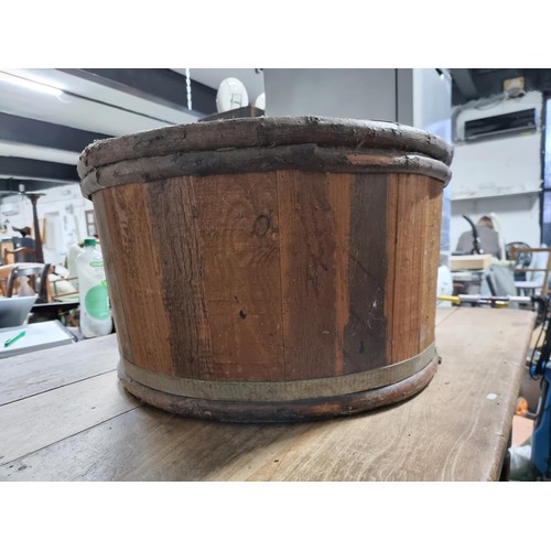 34 - Large wooden barrel formed planter in good condition. Height of 35cm x diameter 66cm