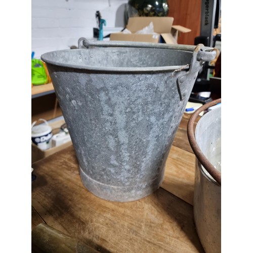 35 - 2x galvanised buckets with no holes along with a large aluminium pan, vintage brass shells, wooden f... 