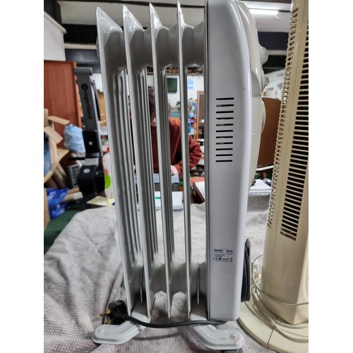 51 - An Igenix oil filled electric radiator along with an Argos tower fan heater