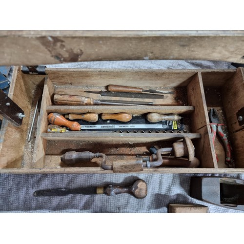 67 - Large wooden carpenters tool box full of carpenters tools inc some good quality vintage hand saws, w... 