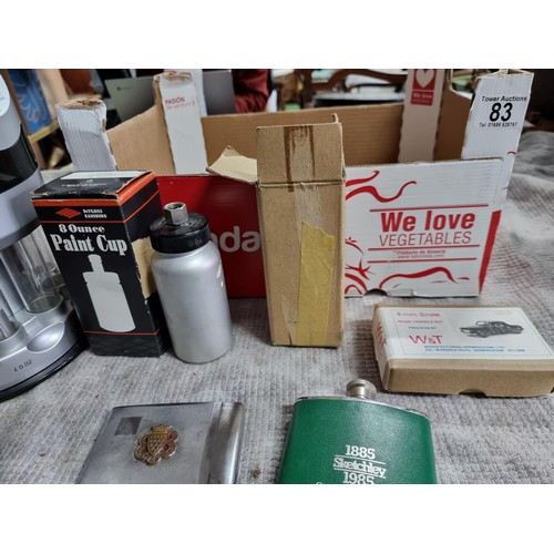 83 - Box of collectables inc a 6 AMp battery charger, cigarette case, 2x paint cups, change coin counter ... 