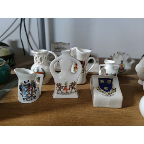 453 - A collection of 33 collectable crestware pieces including a model of Mary Queen of Scots  chair, vas... 