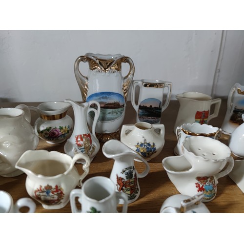 453 - A collection of 33 collectable crestware pieces including a model of Mary Queen of Scots  chair, vas... 