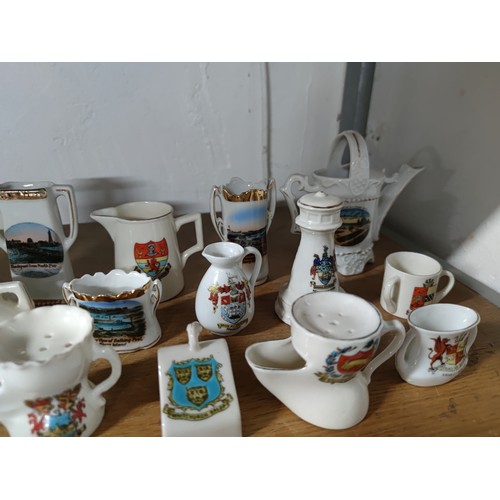 453 - A collection of 33 collectable crestware pieces including a model of Mary Queen of Scots  chair, vas... 