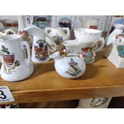 453 - A collection of 33 collectable crestware pieces including a model of Mary Queen of Scots  chair, vas... 