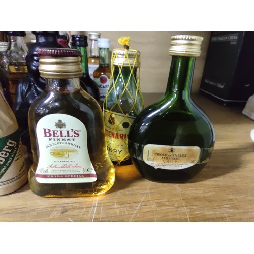 454 - A quantity of 30 alcoholic miniatures including Taylors Port, Disaronno, Bacardi, Grand Marnier, Spr... 