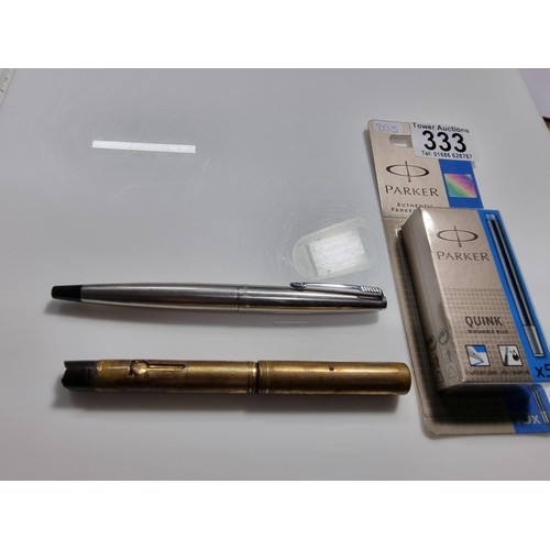 333 - 2x vintage fountain pens inc a Watermans brass fountain pen with a 14k gold nib along with a Parker ... 