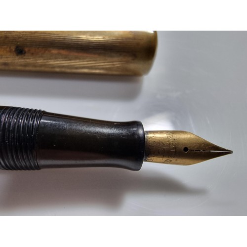 333 - 2x vintage fountain pens inc a Watermans brass fountain pen with a 14k gold nib along with a Parker ... 