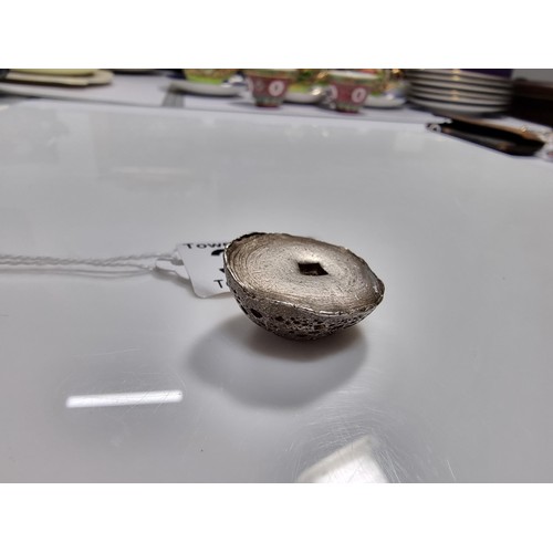 339 - An unusual lump of solid silver with an impressed square stamp appearing to have Asian character mar... 