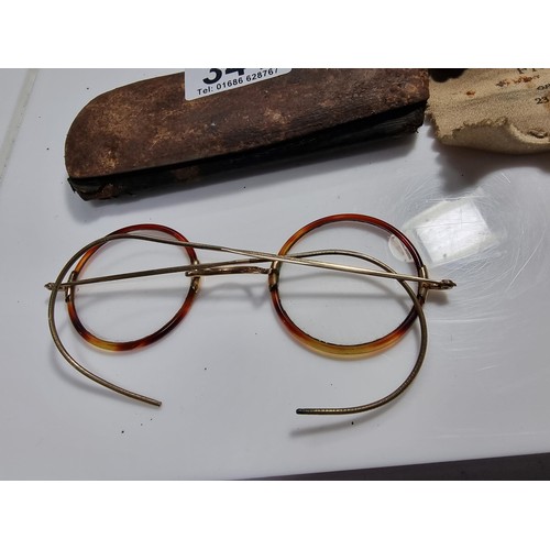 341 - Antique pair of spectacles with attractive tortoise shell rims and with a 12k roll gold frame 1/10 m... 