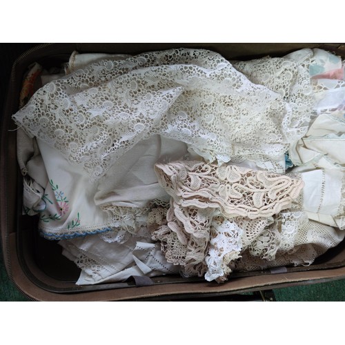 127 - A collection of 3 vintage suitcases containing a quantity of lace, handmade crochet work, a large qu... 