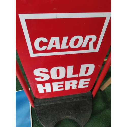 130 - A Zibro Kamin advertisement double sided plastic board. Along with a Calor gas metal swing sign with... 