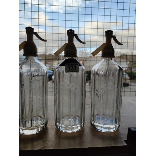 131 - A collection of 3 Schweppes vintage soda siphons, along with an original Kilner dispensing jar. Jar ... 