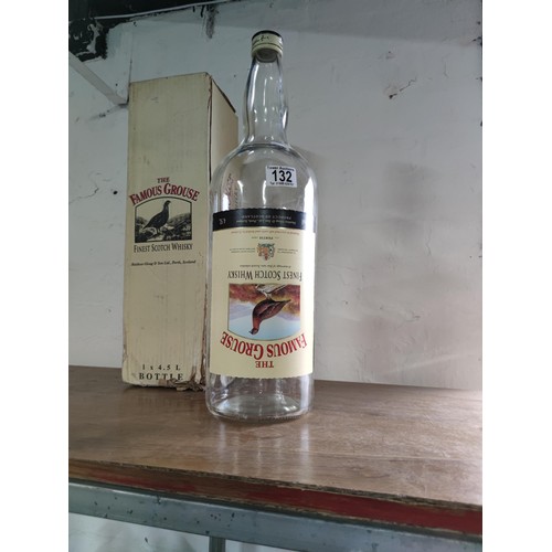 132 - A vintage Famous Grouse 4.5L boxed empty bottle.
49cm.