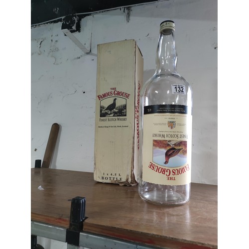 132 - A vintage Famous Grouse 4.5L boxed empty bottle.
49cm.