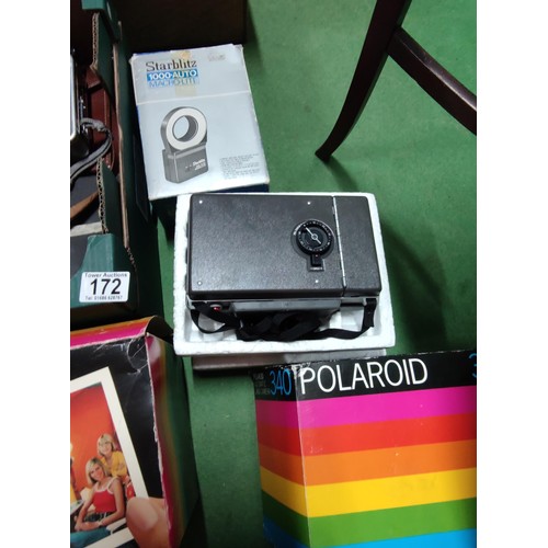 172 - A collection of camera and flashes including a boxed polaroid 340, a polaroid super colour swinger l... 