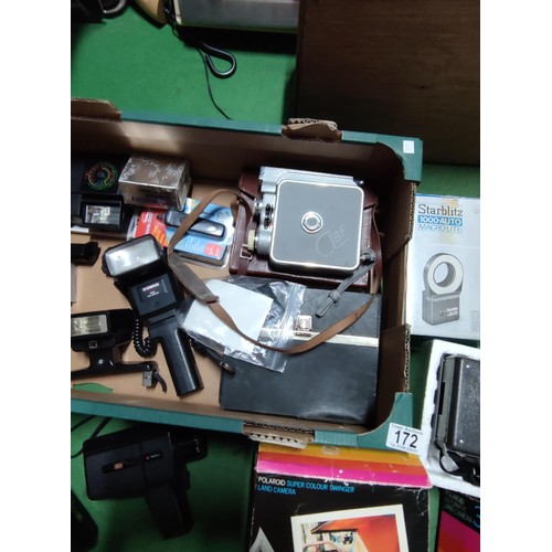 172 - A collection of camera and flashes including a boxed polaroid 340, a polaroid super colour swinger l... 